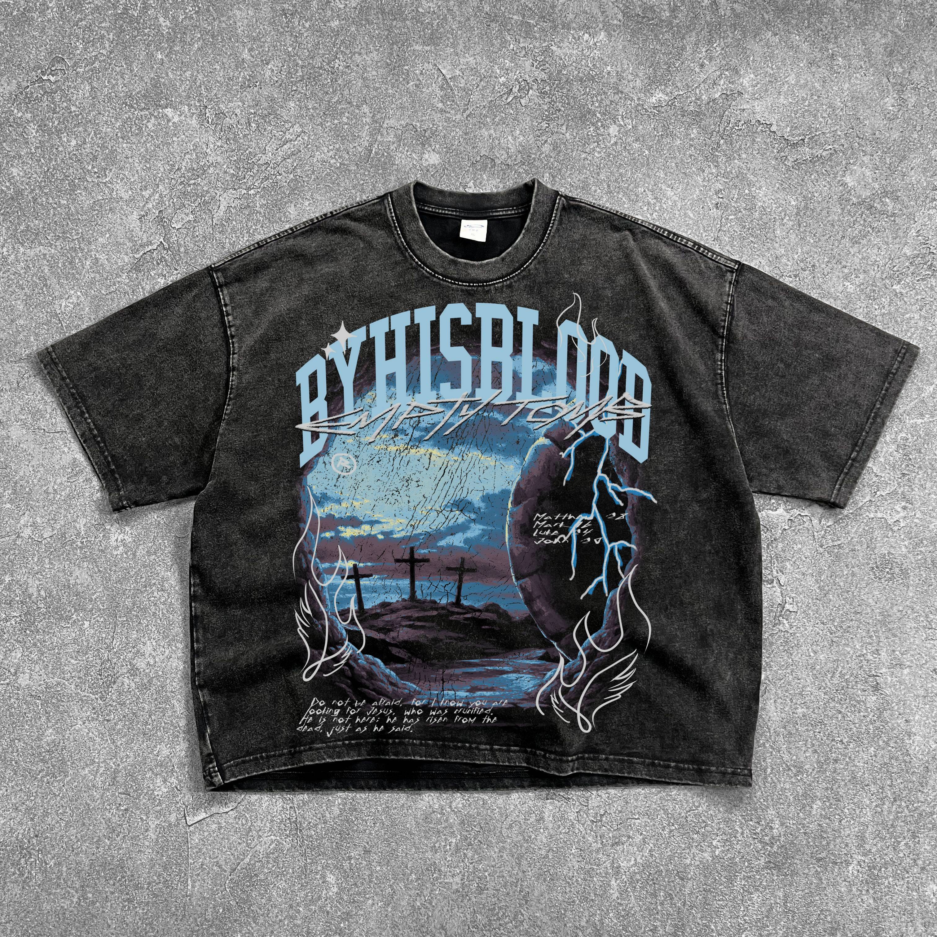 Black t-shirt with graphic design and text on a gray surface